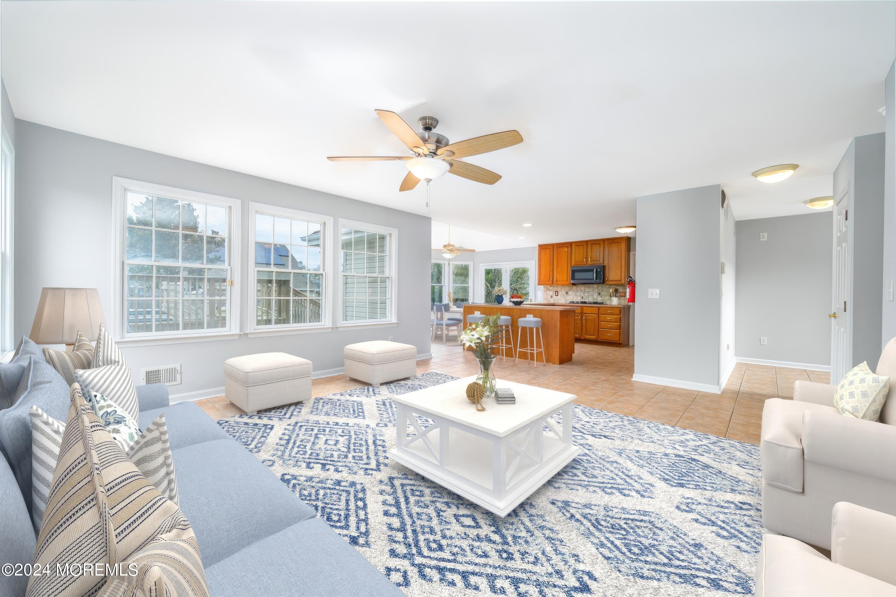 120 Leeward Road Manahawkin, NJ 08050 - Photo 12 of 23 a living room with furniture and a large window