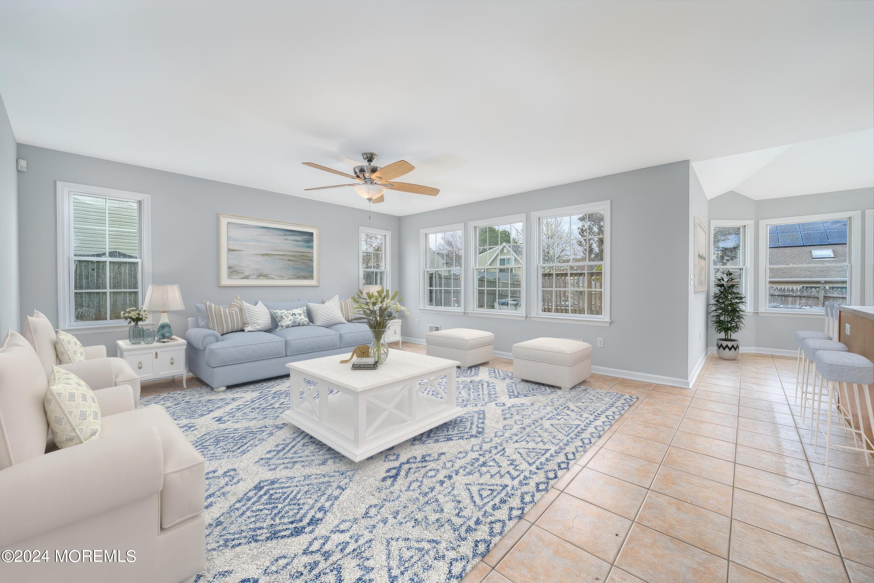 120 Leeward Road Manahawkin, NJ 08050 - Photo 13 of 23 a living room with furniture and a large window