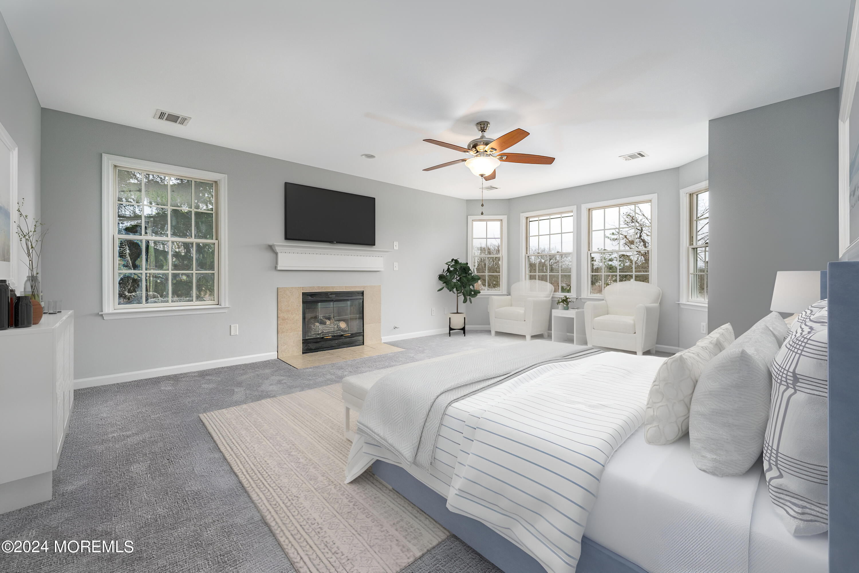 120 Leeward Road Manahawkin, NJ 08050 - Photo 15 of 23 a spacious bedroom with a large bed and a flat screen tv