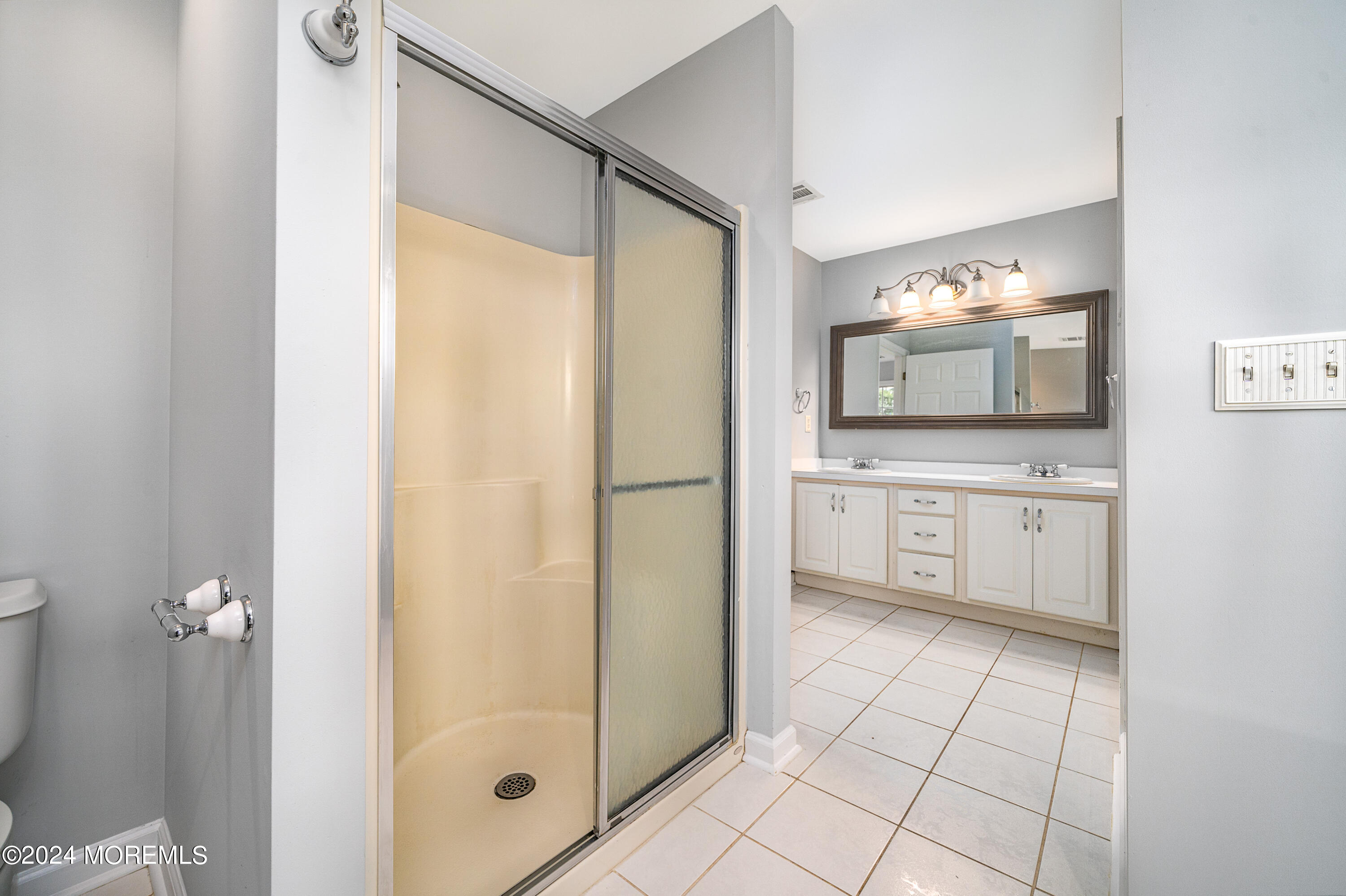120 Leeward Road Manahawkin, NJ 08050 - Photo 19 of 23 a bathroom with a granite countertop sink mirror and shower
