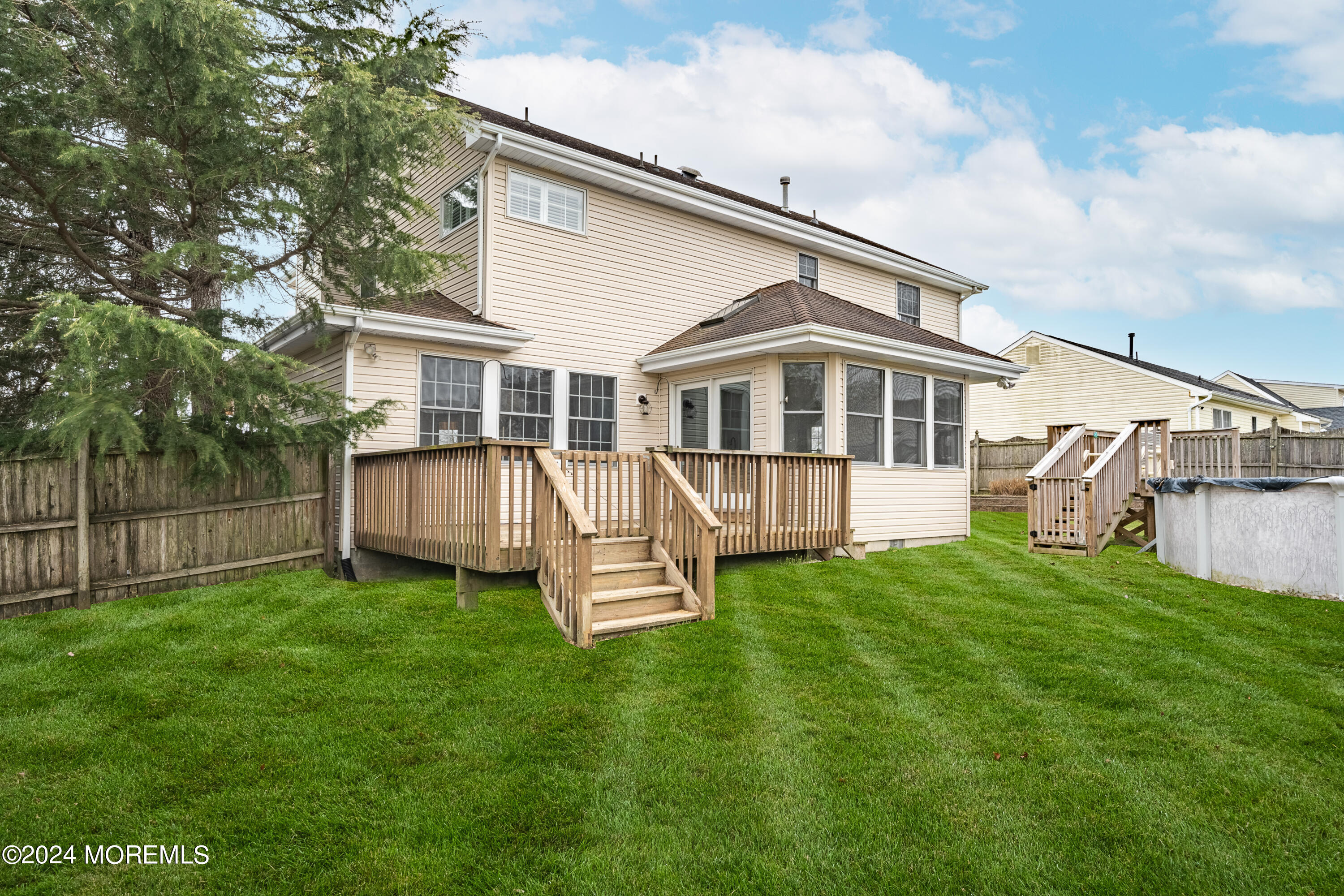 120 Leeward Road Manahawkin, NJ 08050 - Photo 23 of 23 a view of a house with a yard and sitting area