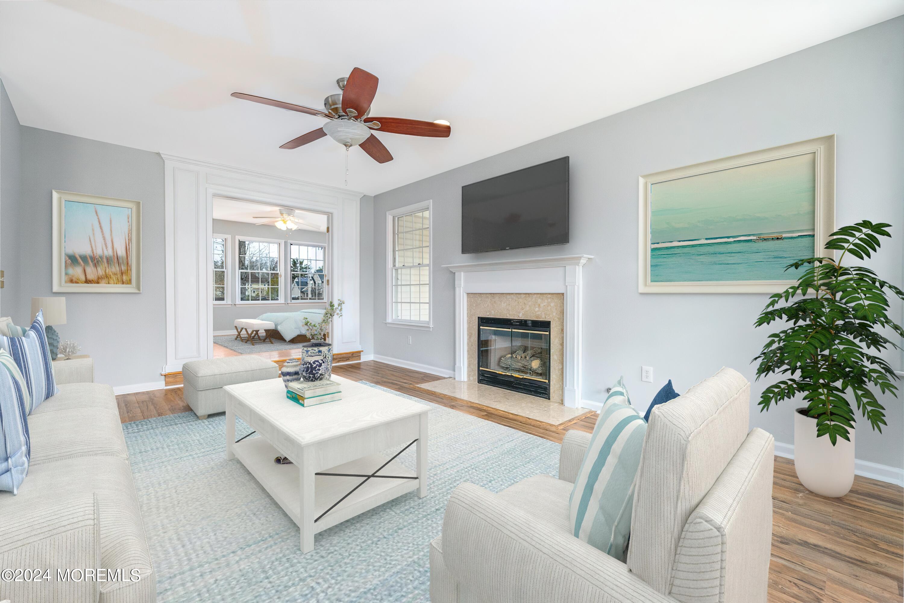 120 Leeward Road Manahawkin, NJ 08050 - Photo 5 of 23 a living room with furniture and a fireplace