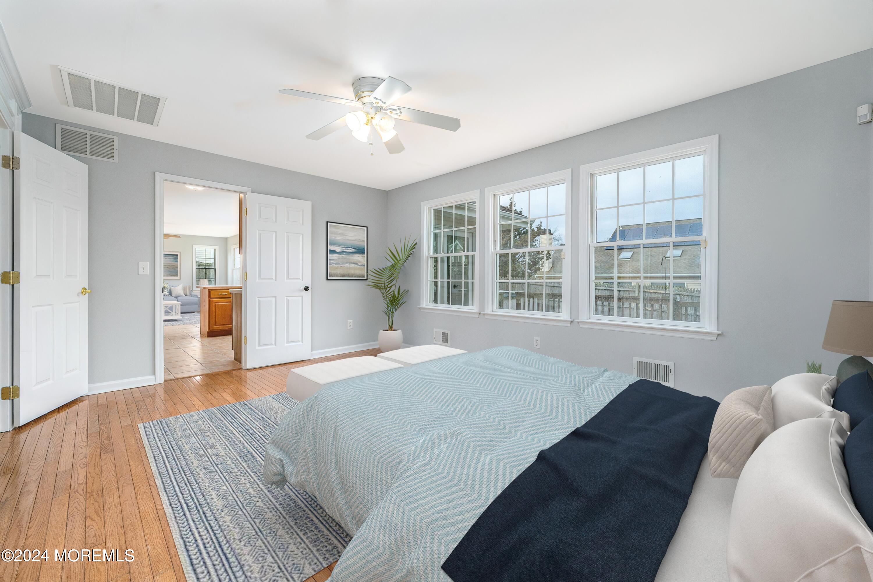 120 Leeward Road Manahawkin, NJ 08050 - Photo 7 of 23 a bedroom with a large bed and a window