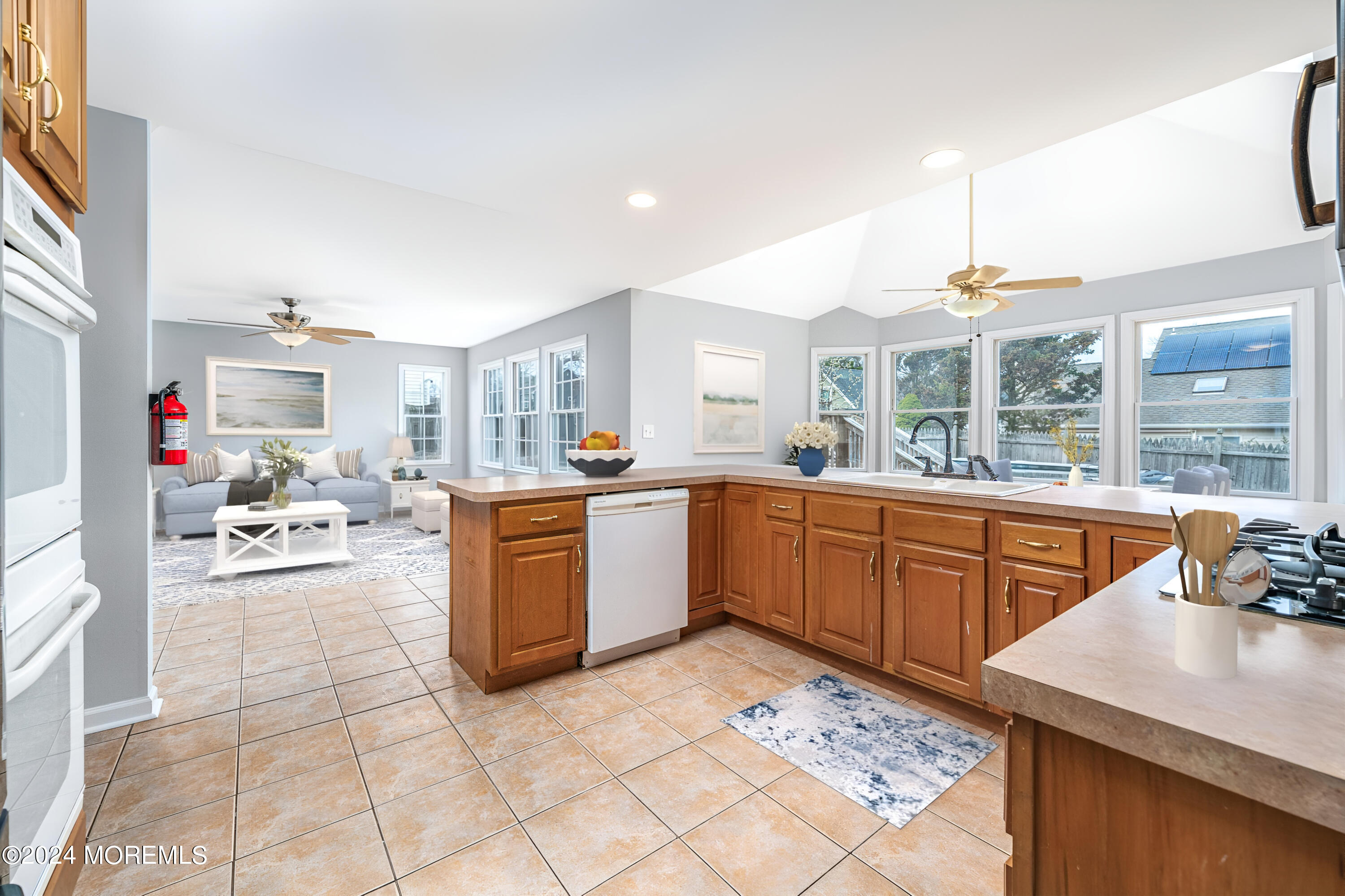 120 Leeward Road Manahawkin, NJ 08050 - Photo 8 of 23 a kitchen with a sink stove and cabinets