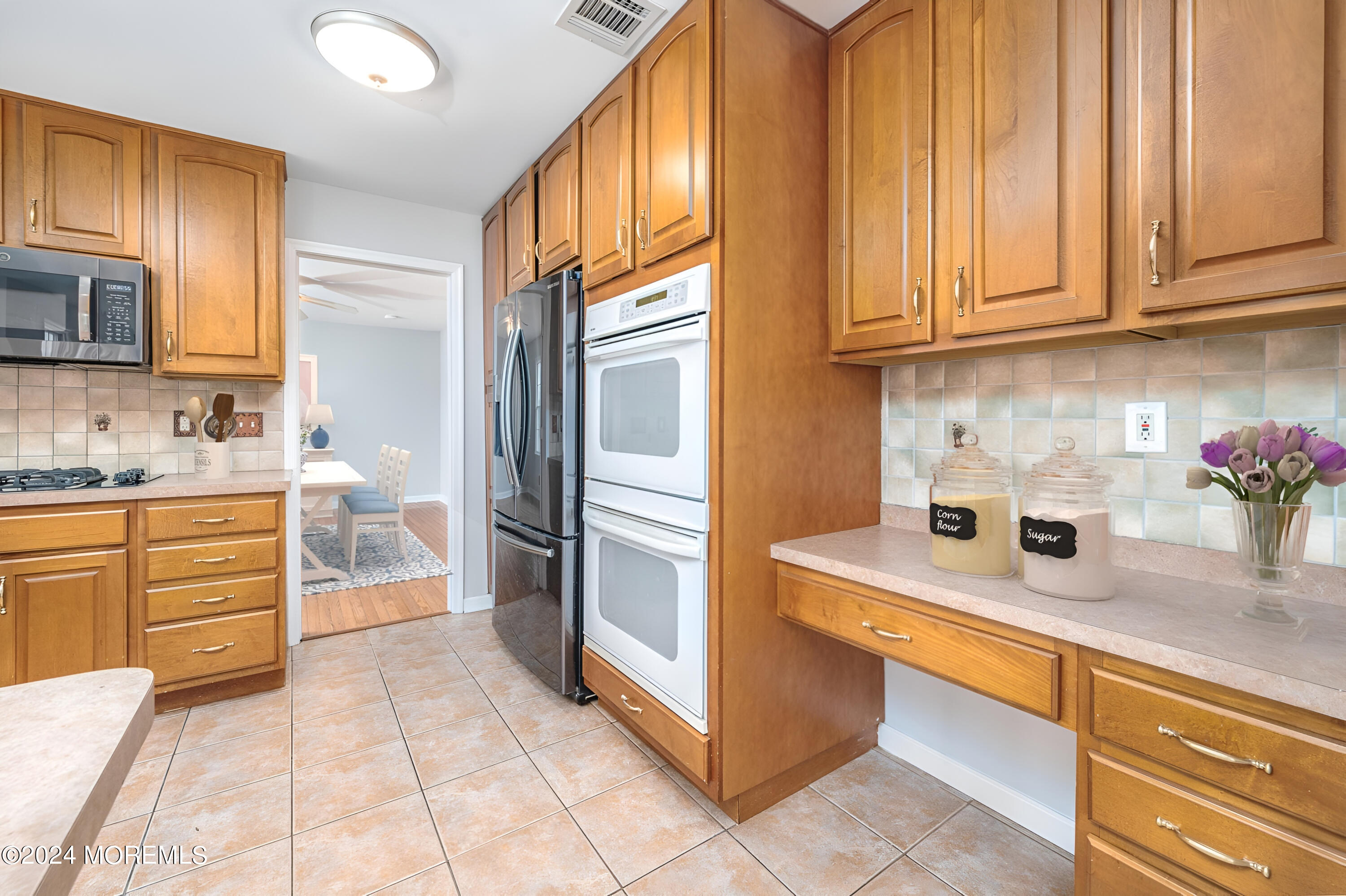 120 Leeward Road Manahawkin, NJ 08050 - Photo 10 of 23 a kitchen with granite countertop cabinets and steel stainless steel appliances