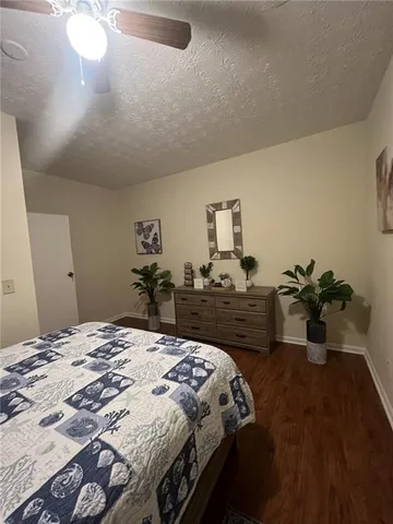 a bathroom with a toilet a sink and shower