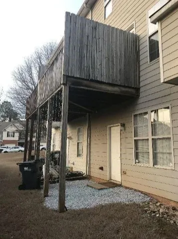 a view of house with wooden door