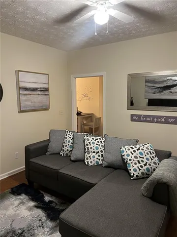 a large white kitchen with lots of counter space a sink and appliances