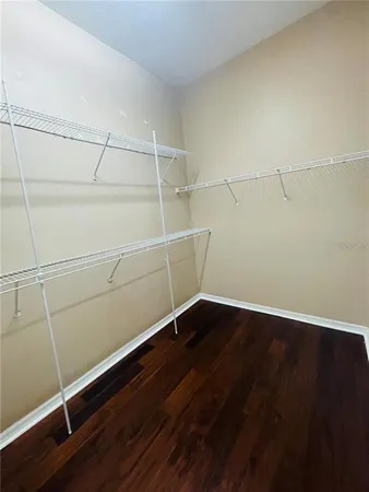 an empty room with wooden floor