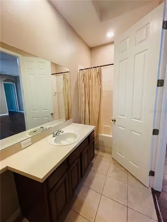 a bathroom with a sink a vanity and a mirror