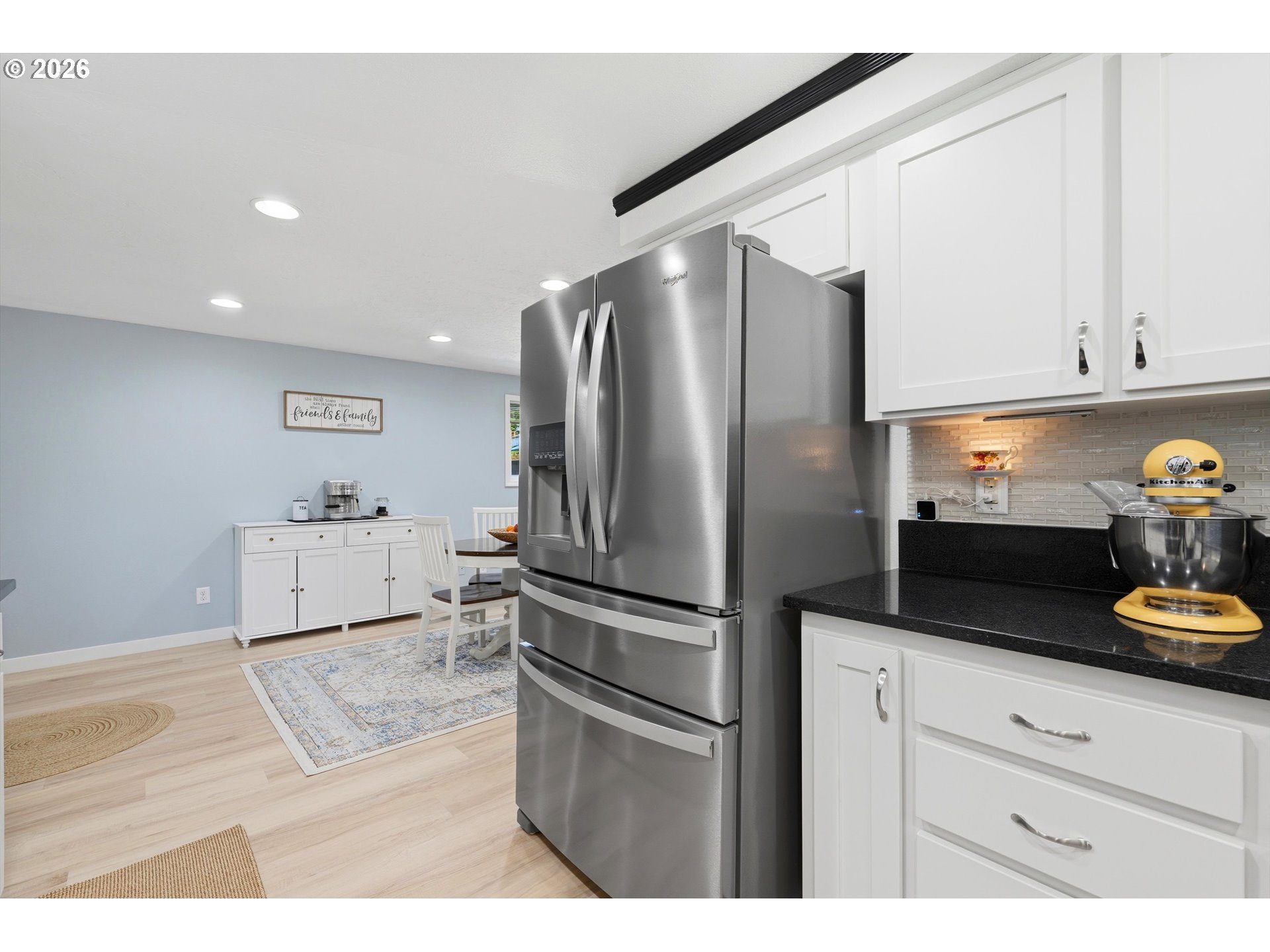 5095 Southeast Roethe Road Milwaukie, OR 97267 - Photo 11 of 28 a kitchen with stainless steel appliances granite countertop a refrigerator and a stove