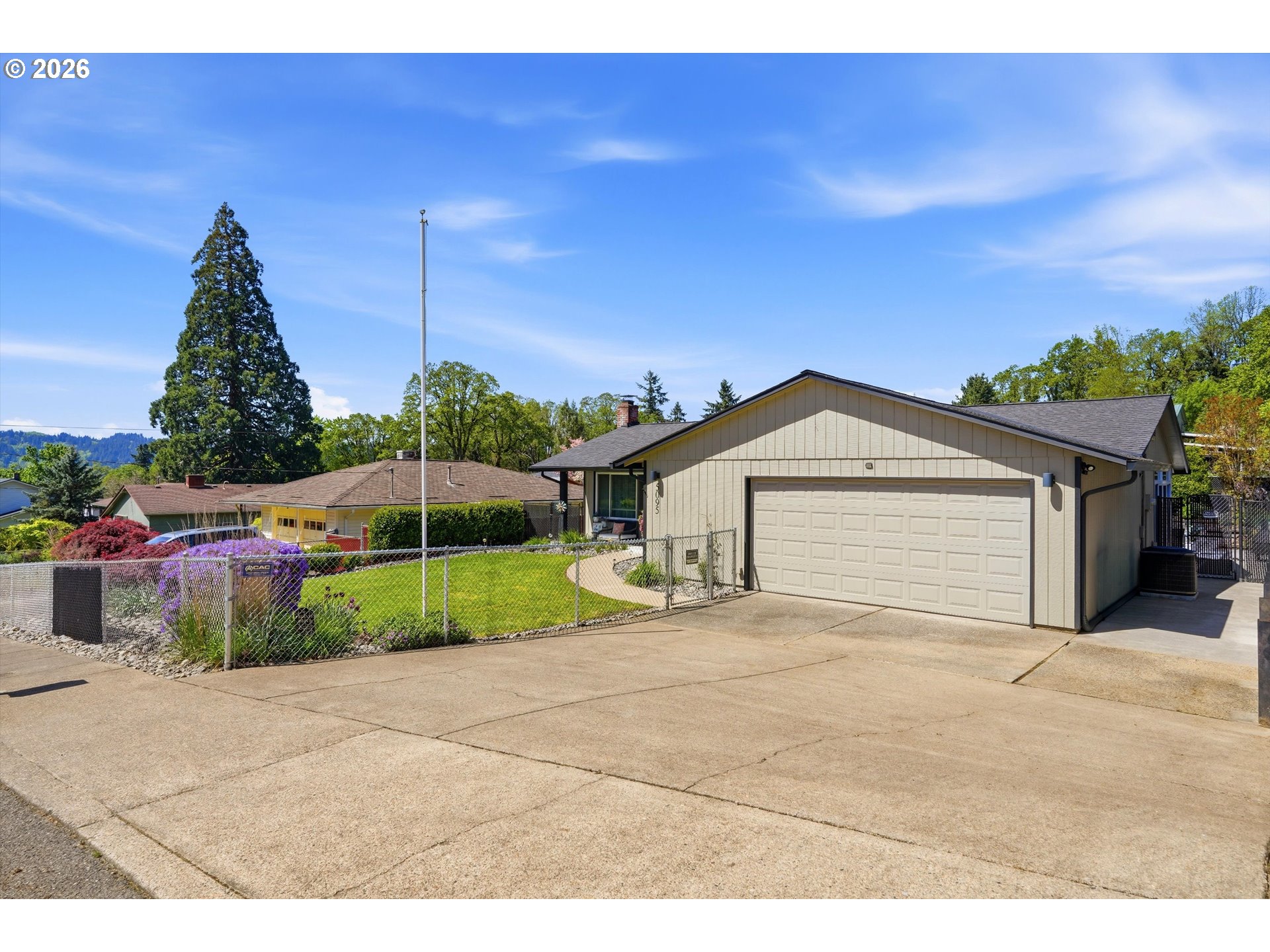5095 Southeast Roethe Road Milwaukie, OR 97267 - Photo 2 of 28 a view of a house with a yard and potted plants