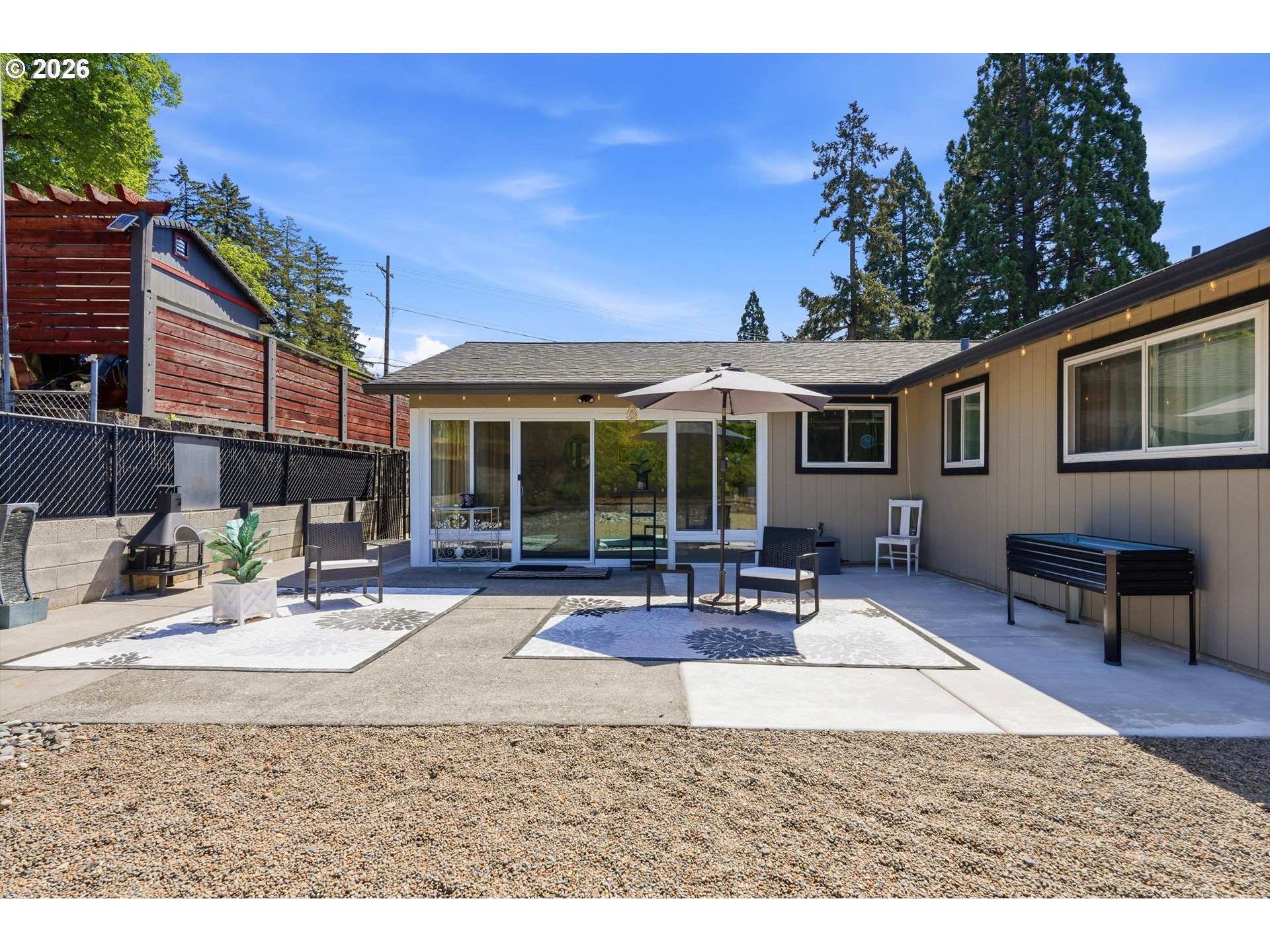 5095 Southeast Roethe Road Milwaukie, OR 97267 - Photo 24 of 28 a building outdoor space with patio furniture and potted plants