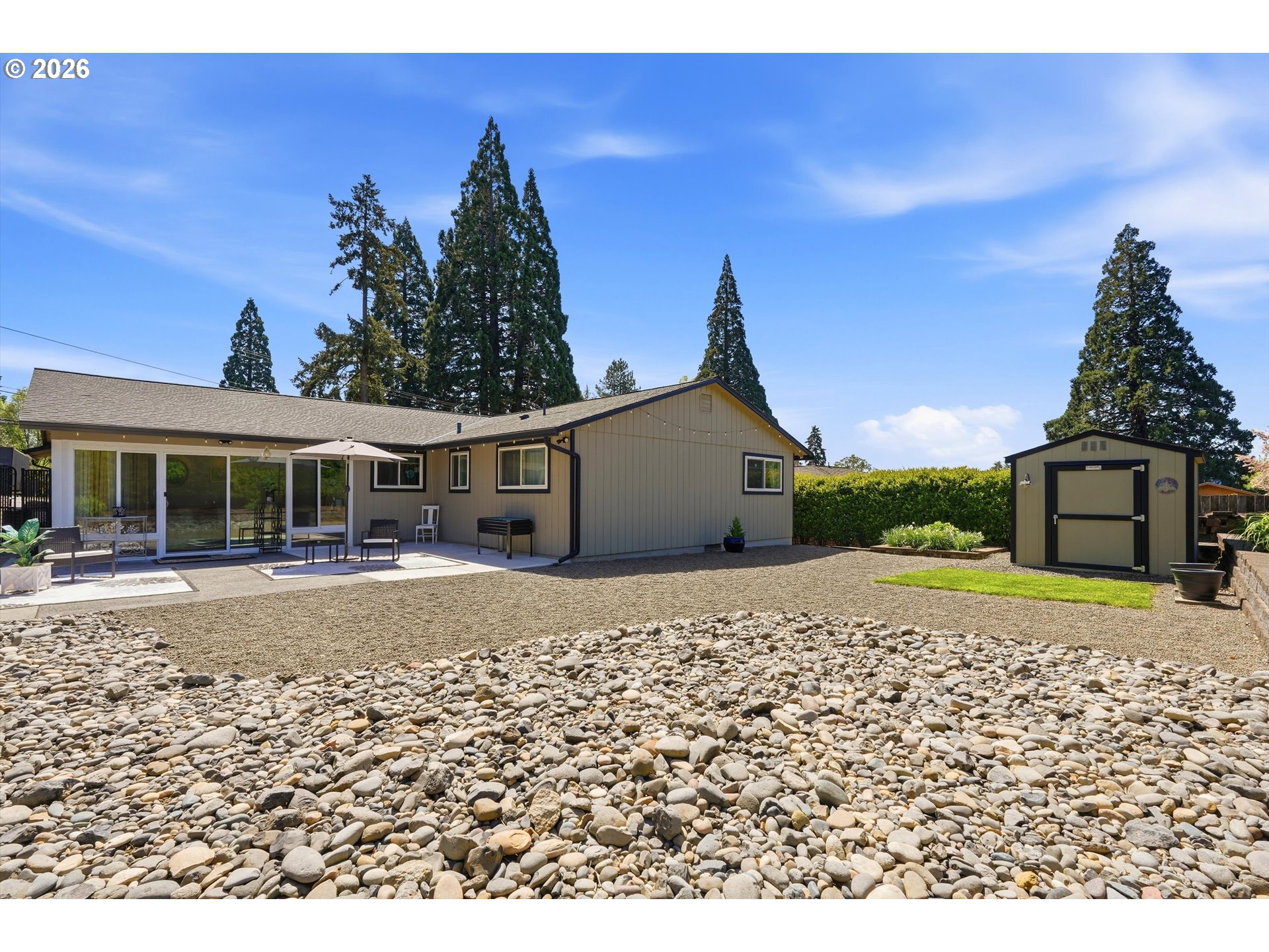 5095 Southeast Roethe Road Milwaukie, OR 97267 - Photo 26 of 28 a front view of a house with a yard