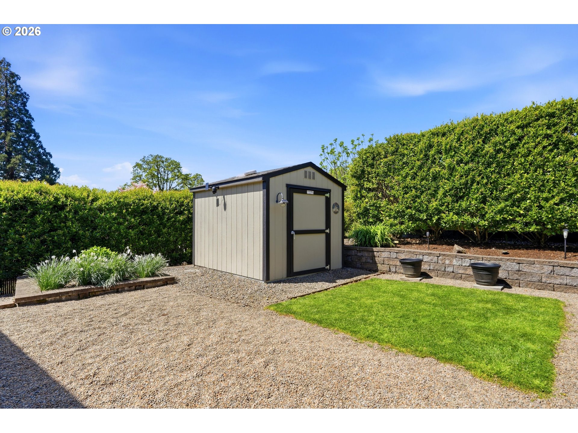 5095 Southeast Roethe Road Milwaukie, OR 97267 - Photo 27 of 28 a view of a house with a yard and sitting area