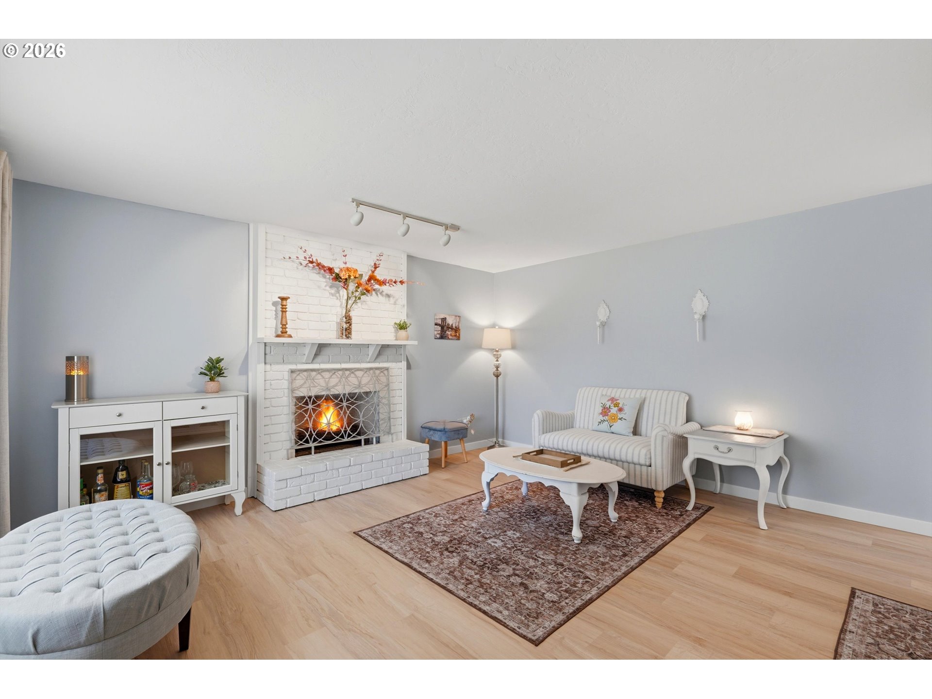 5095 Southeast Roethe Road Milwaukie, OR 97267 - Photo 6 of 28 a living room with furniture and a fireplace