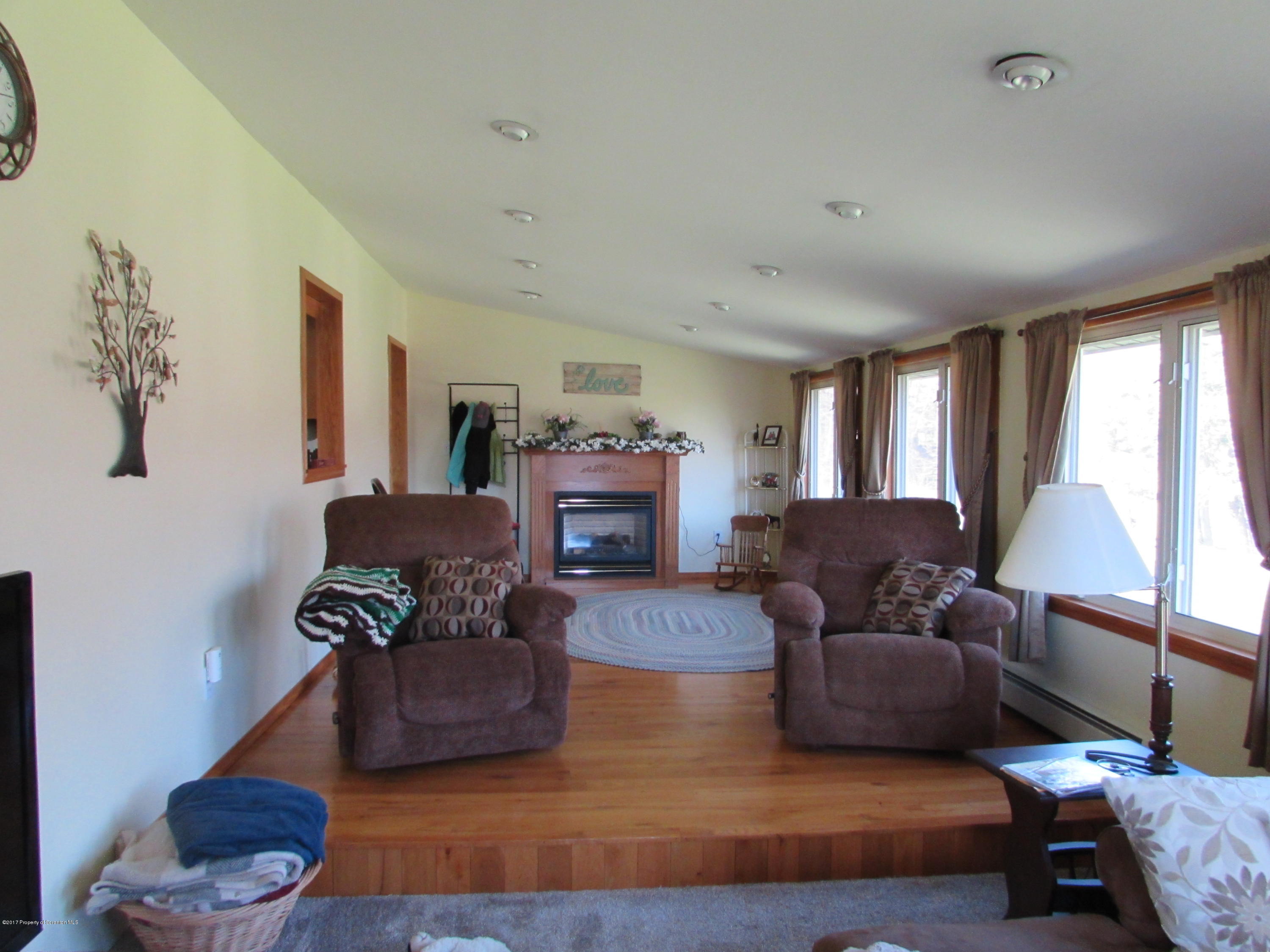 28 Ripplebrook Road Tunkhannock, PA 18657 - Photo 4 of 19 a living room with furniture and a fireplace