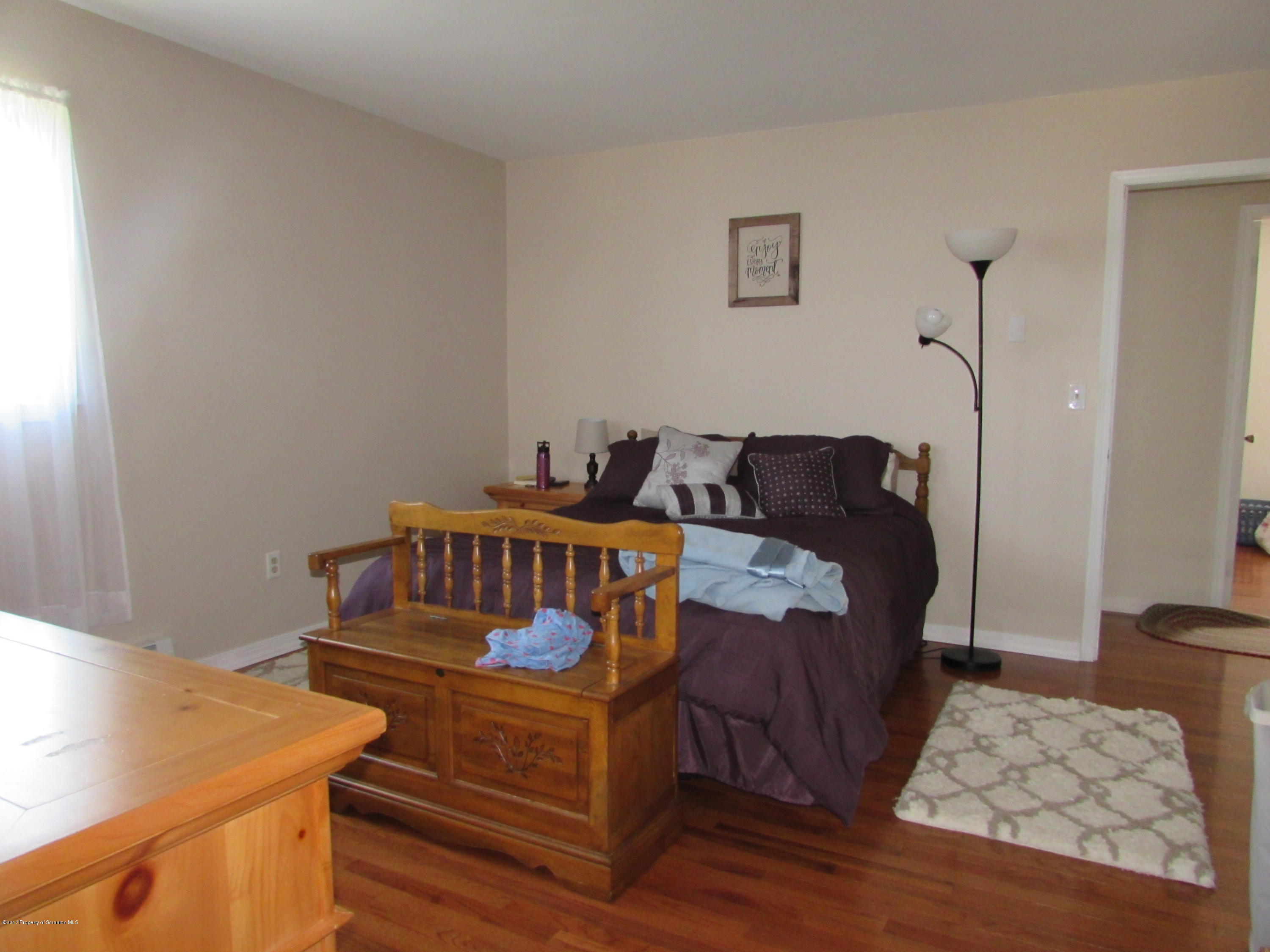 28 Ripplebrook Road Tunkhannock, PA 18657 - Photo 8 of 19 a bedroom with furniture and wooden floor