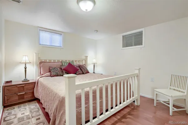 a bedroom with a bed and a chair