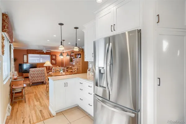 a kitchen with stainless steel appliances a refrigerator and a stove