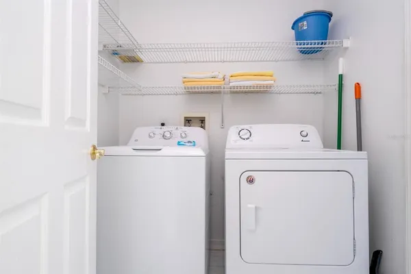 a utility room with dryer and washer