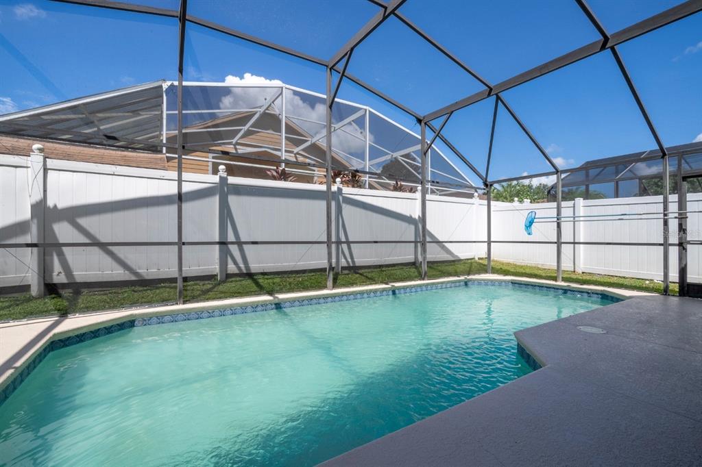 4669 Prairie Point Boulevard Kissimmee, FL 34746 - Photo 5 of 13 a view of a backyard with swimming pool