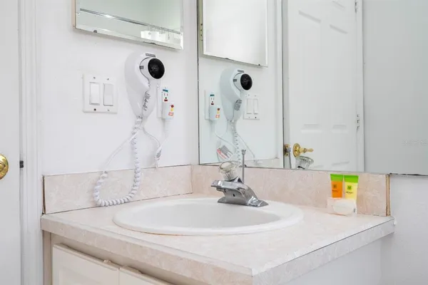 a bathroom with a sink and a mirror
