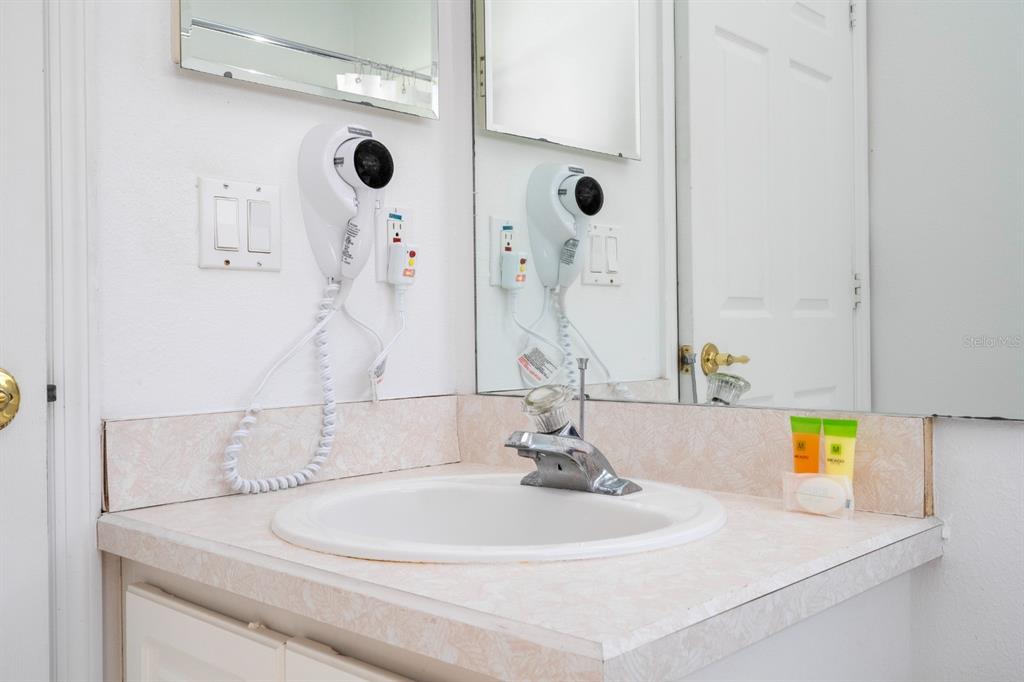 4669 Prairie Point Boulevard Kissimmee, FL 34746 - Photo 9 of 13 a bathroom with a sink and a mirror