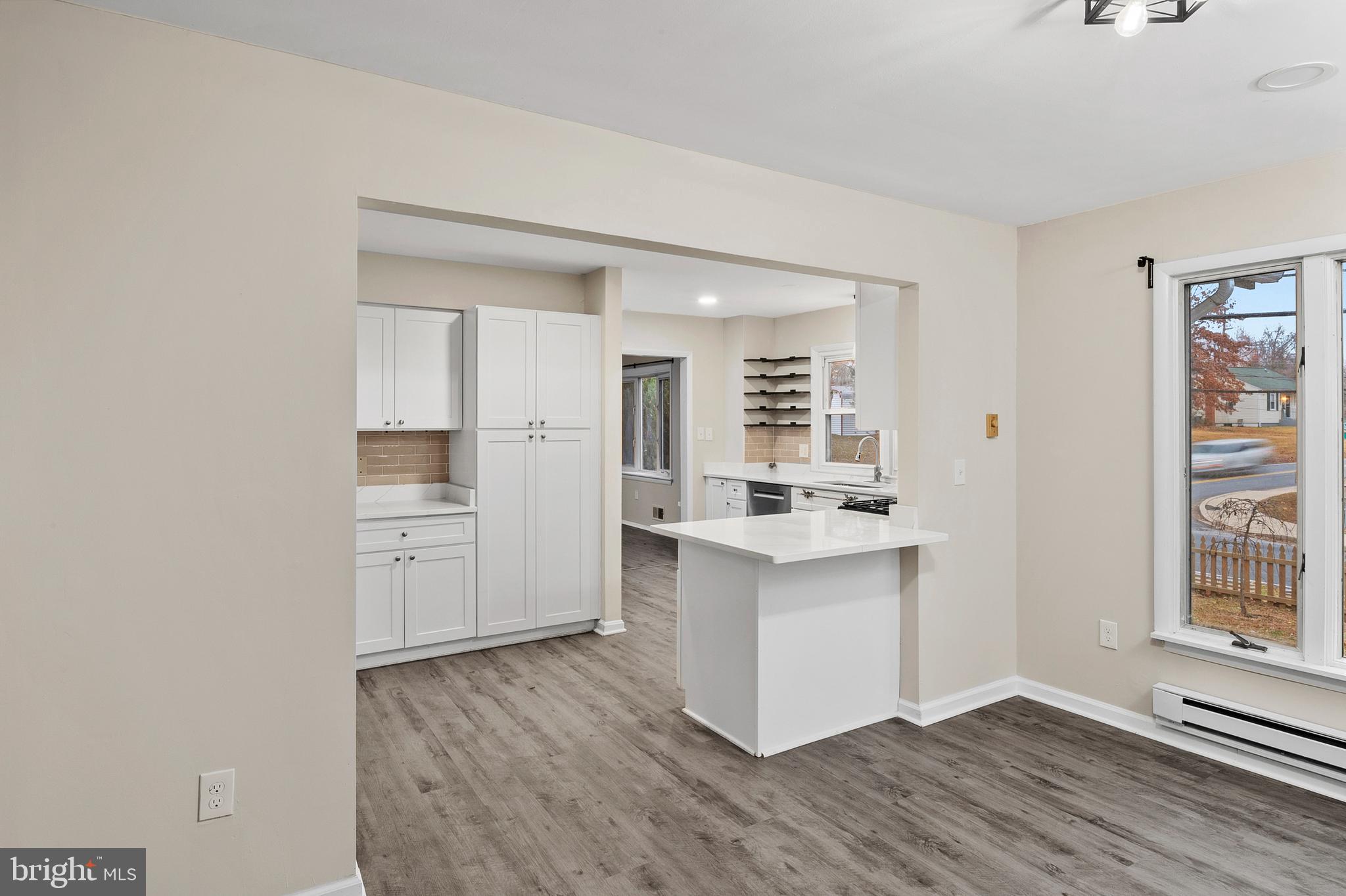 8084 Clark Station Road Severn, MD 21144 - Photo 10 of 36 a kitchen with a refrigerator and a stove top oven