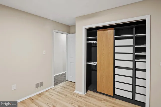 a view of room with window and hardwood floor