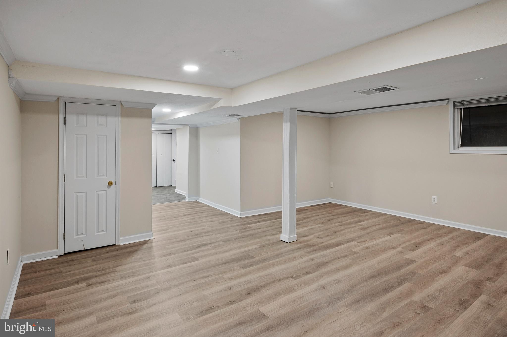 8084 Clark Station Road Severn, MD 21144 - Photo 19 of 36 a view of an empty room with wooden floor