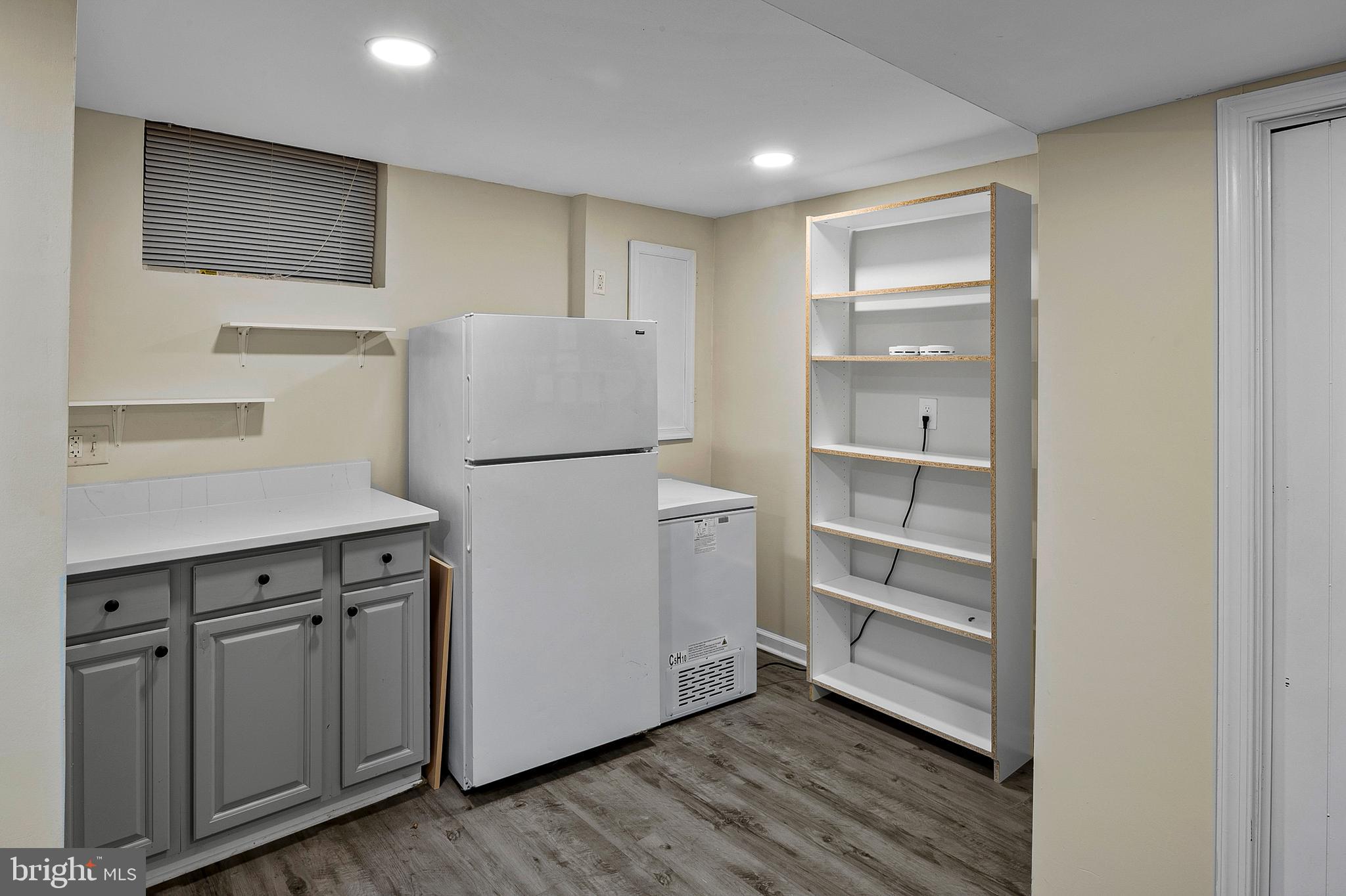 8084 Clark Station Road Severn, MD 21144 - Photo 22 of 36 a view of a kitchen with refrigerator and wooden floor
