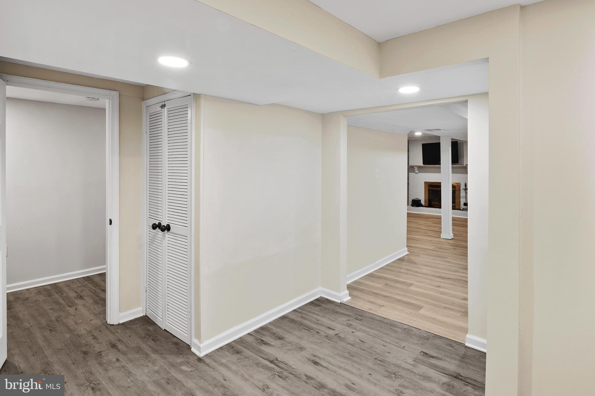 8084 Clark Station Road Severn, MD 21144 - Photo 24 of 36 a view of a hallway with wooden floor