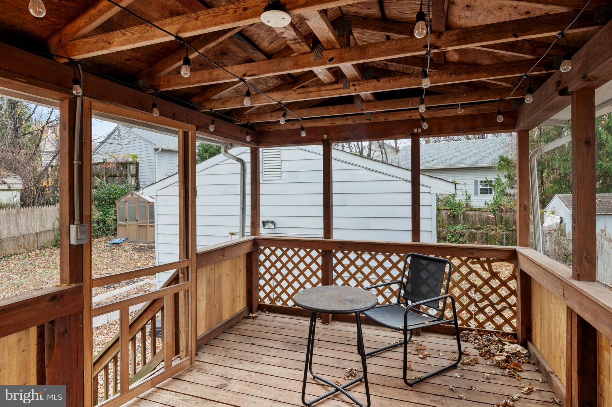 8084 Clark Station Road Severn, MD 21144 - Photo 26 of 36 a view of a chairs in wooden deck