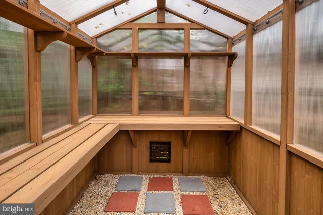 a backyard of a house with a tree