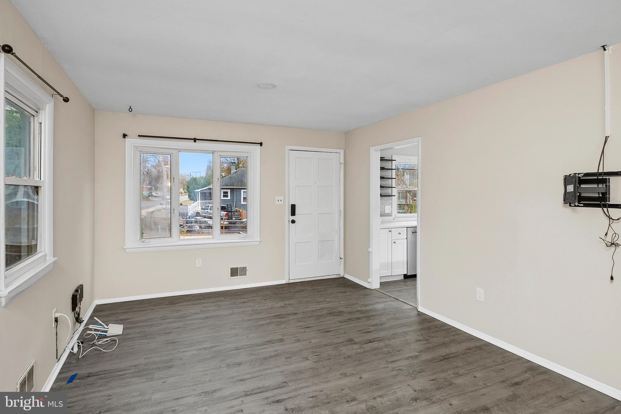 8084 Clark Station Road Severn, MD 21144 - Photo 4 of 36 a view of a livingroom with wooden floor and window
