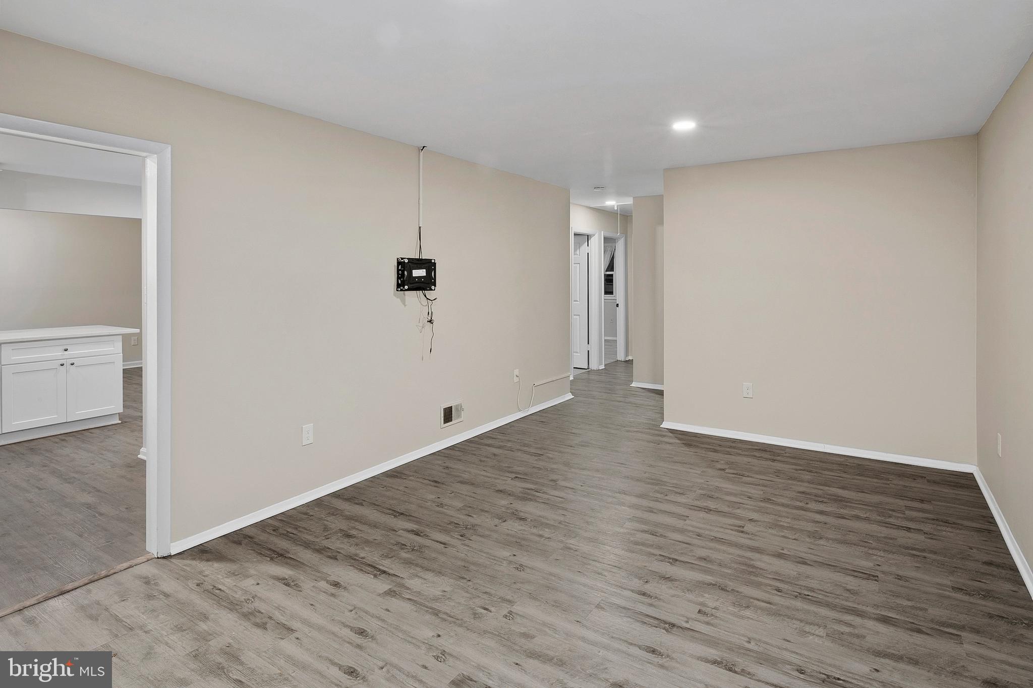 8084 Clark Station Road Severn, MD 21144 - Photo 5 of 36 a view of an empty room with wooden floor and closet