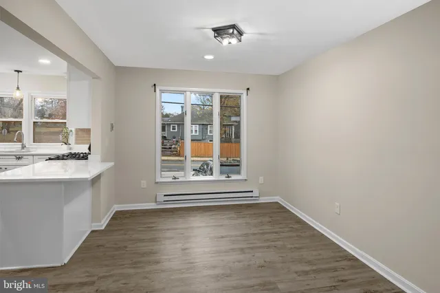 a kitchen with appliances cabinets and a window