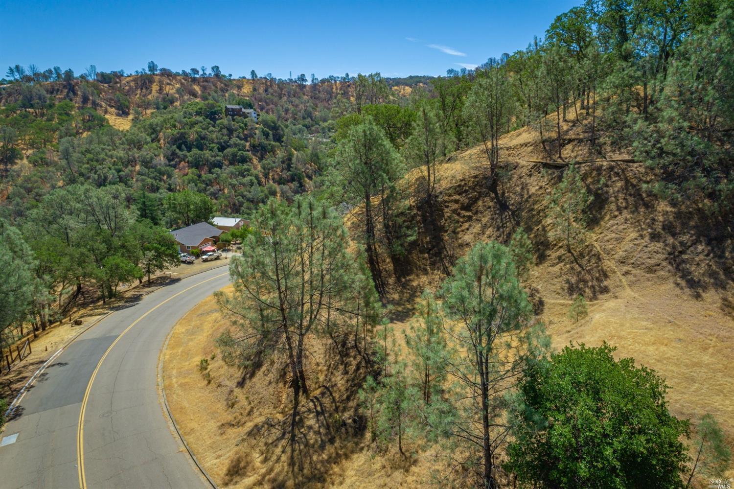 1268 Steele Canyon Road Napa, CA 94558 - Photo 16 of 29 an aerial view of lake residential house with outdoor space and trees all around