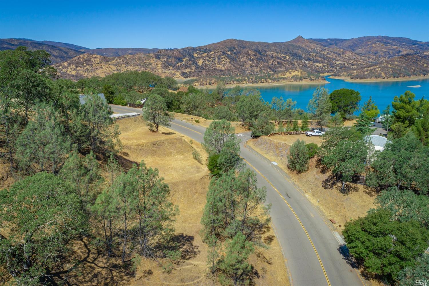 1268 Steele Canyon Road Napa, CA 94558 - Photo 21 of 29 a view of a lake with mountains in the background