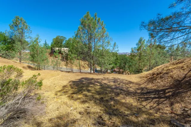 a view of yard covered with snow in front of house