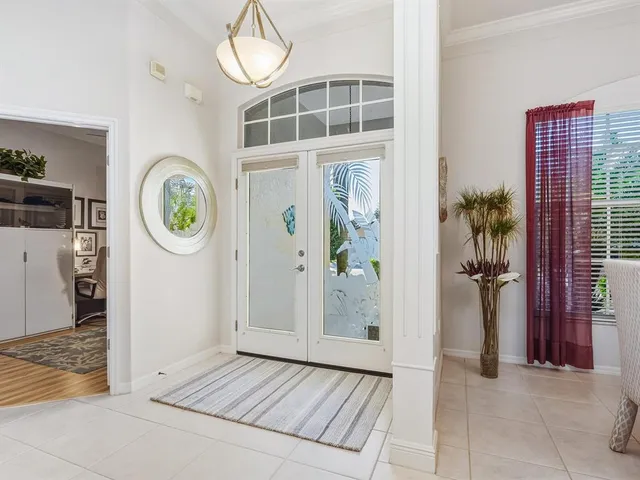 a view of a hallway with wooden walls and windows