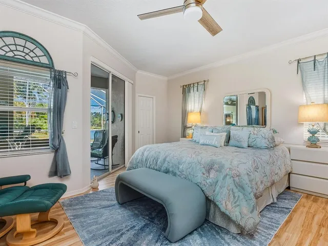 a bedroom with a bed couch and window