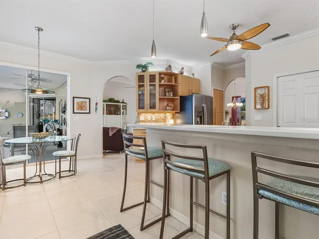 a dining room with furniture and window