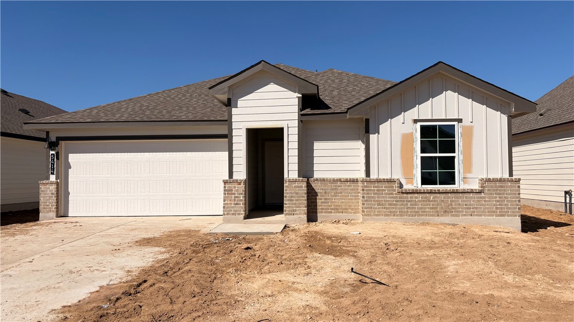 5414 Bear Run Bryan, TX 77807 - Photo 1 of 1 a front view of a house with a yard and garage
