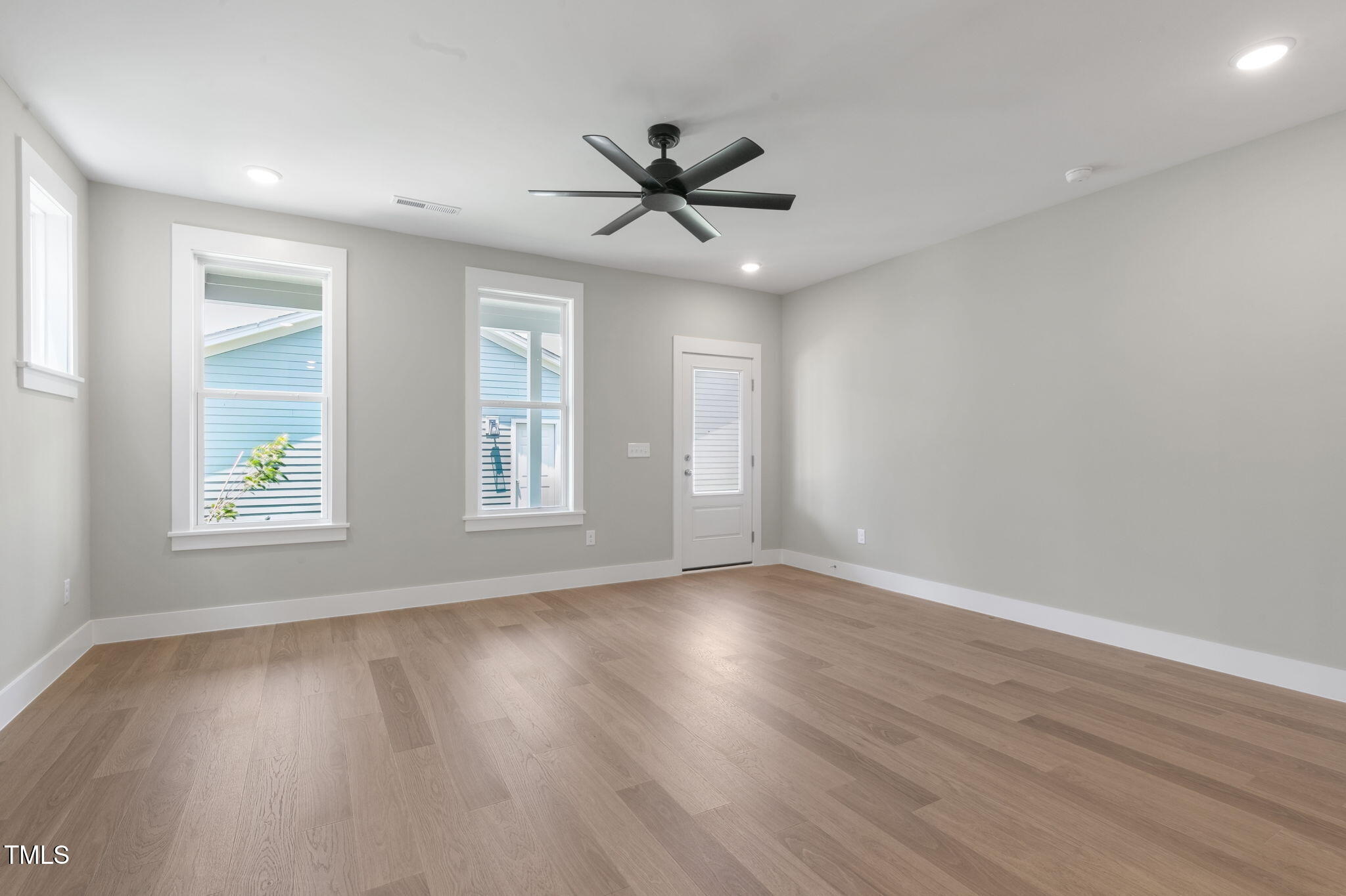 1556 Piney Fls Drive Wendell, NC 27591 - Photo 11 of 43 a view of an empty room with wooden floor and a window