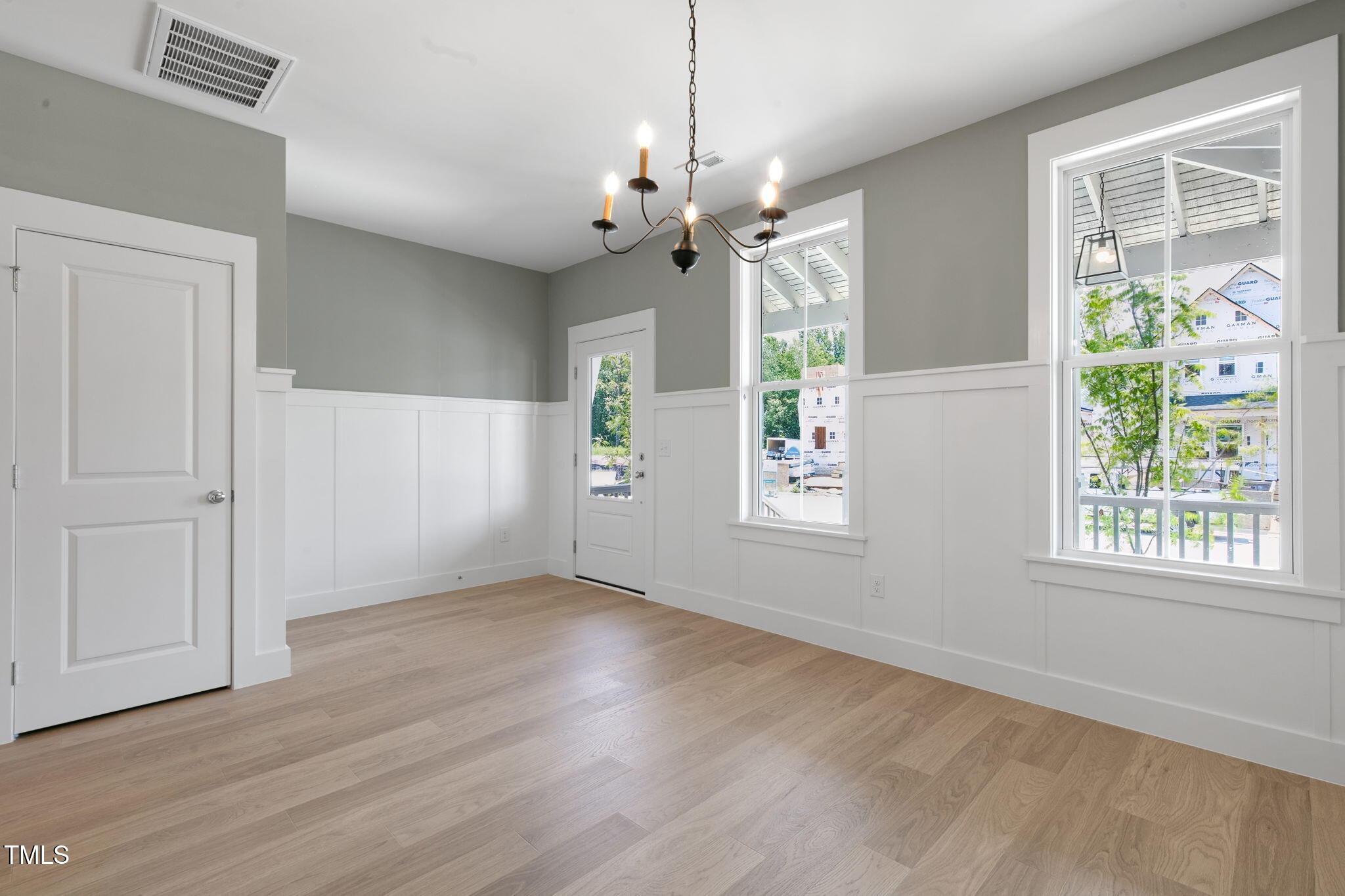 1556 Piney Fls Drive Wendell, NC 27591 - Photo 12 of 43 a view of an empty room with a window and wooden floor