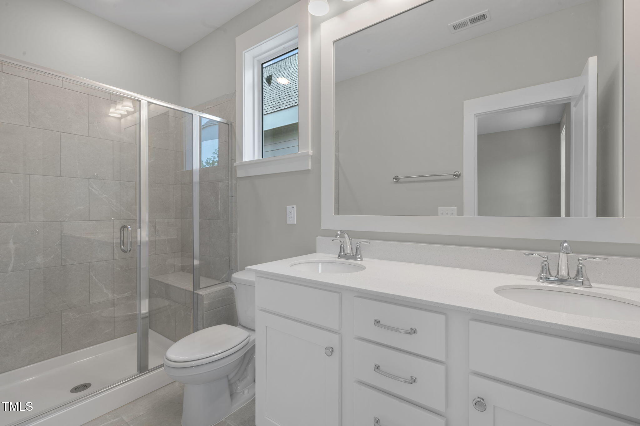 1556 Piney Fls Drive Wendell, NC 27591 - Photo 26 of 43 a bathroom with a sink a toilet and shower