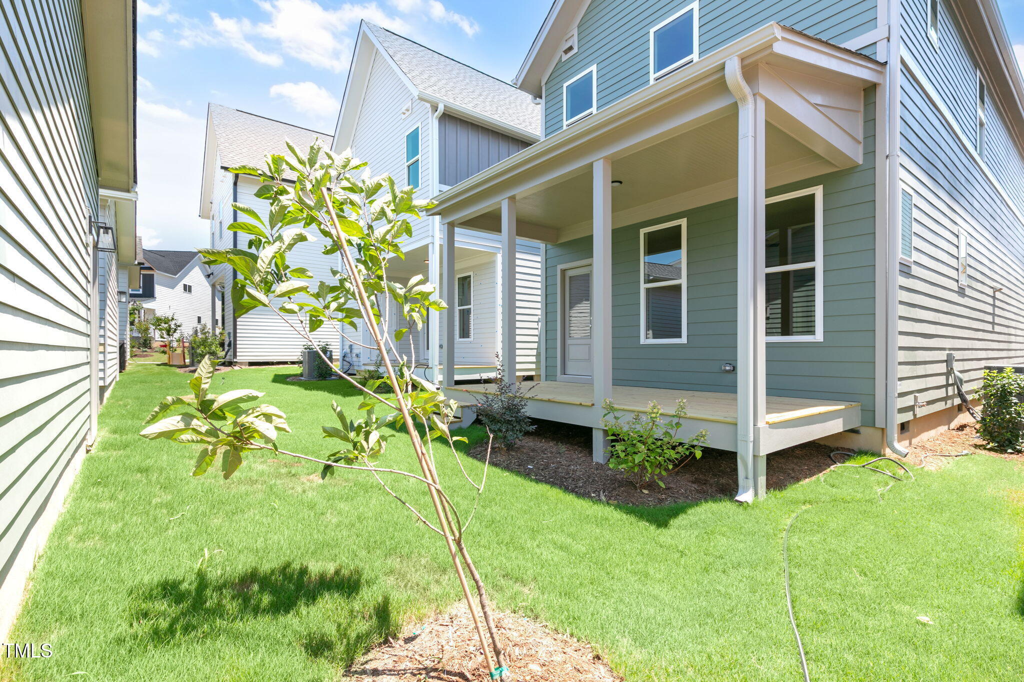 1556 Piney Fls Drive Wendell, NC 27591 - Photo 32 of 43 a backyard of a house with table and chairs