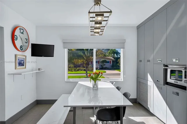 a view of kitchen with furniture and a window